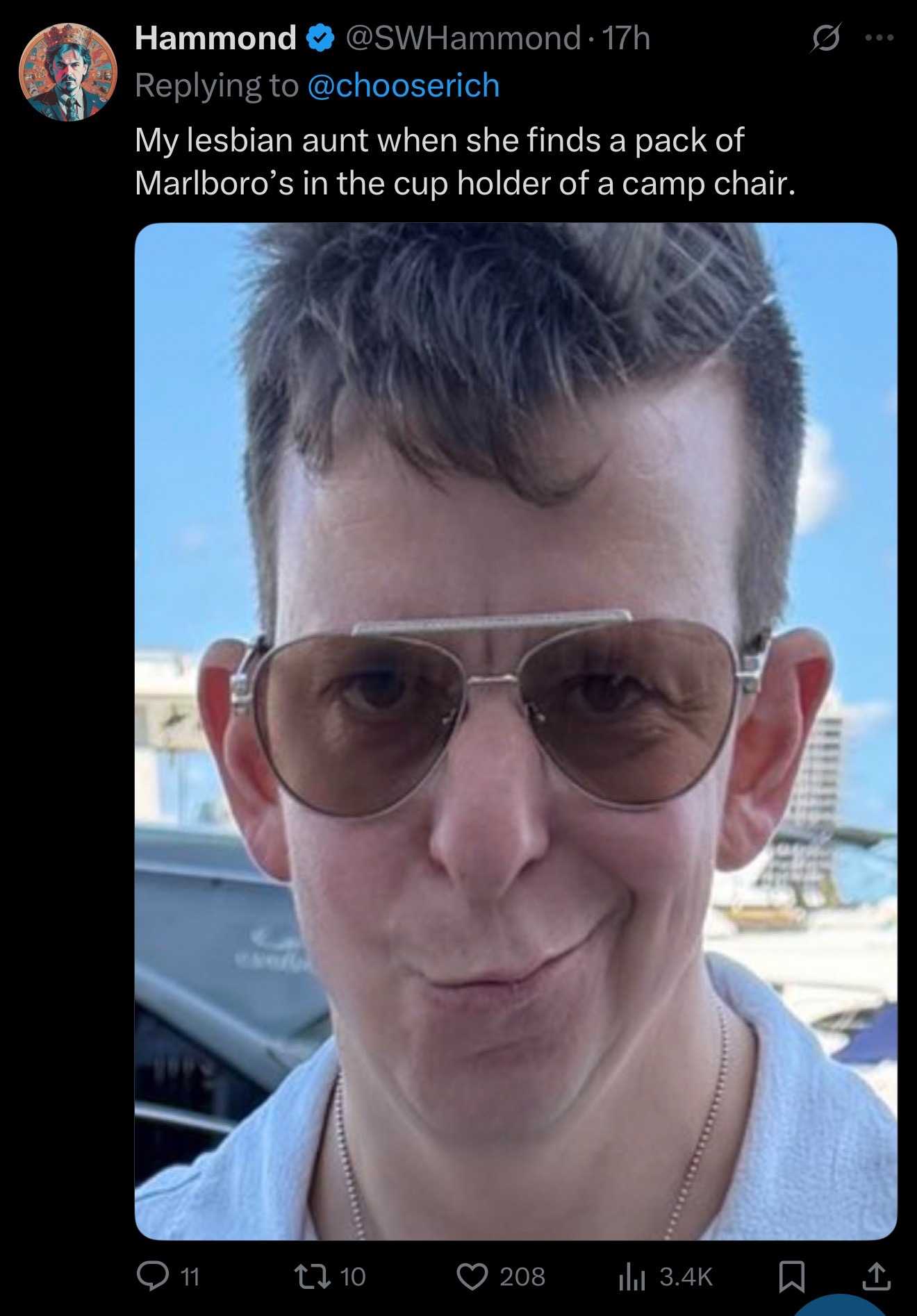 @ChooseRich smirking with the caption, "My lesbian aunt finding a pack of Marlboro's in the cup holder of a camp chair."